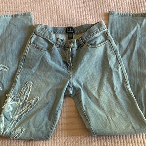 INC Internashion Concept jeans. light wash, low waisted, embroidered design.